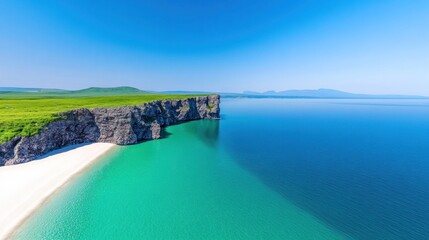 Fototapeta premium A serene coastal landscape with cliffs and clear turquoise waters.