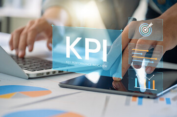 Businessman Reviewing KPI Metrics on Tablet and Laptop for Performance Analysis, Goals Tracking, Evaluate Growth, Financial Insights, Corporate Success and Productivity Management.