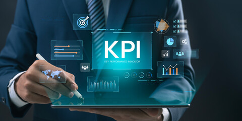 Business Professional Using KPI Dashboard and Digital Analytics Tools for Strategic Planning,...