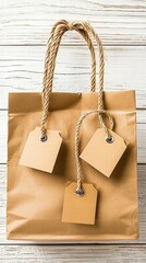 Brown Paper Shopping Bag with Blank Tags on White Wooden Background
