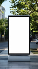 A large blank billboard stands on a city sidewalk, next to lush green trees. The white screen is ready for an advertisement. A street scene is visible in the background.