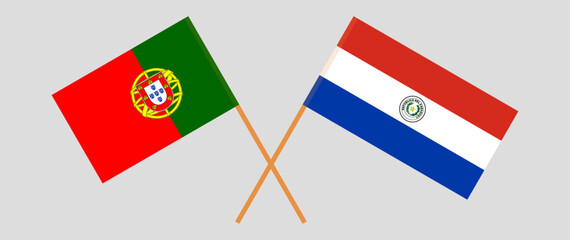 Crossed flags of Portugal and Republic of Paraguay. Official colors. Correct proportion. Vector illustration