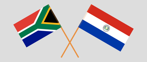 Crossed flags of South Africa and Republic of Paraguay. Official colors. Correct proportion. Vector illustration