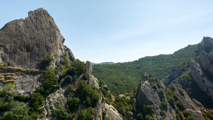 Obraz premium Aerial view of a mountain peak in the Lucanian Dolomites near Castelmezzano, in the province of Potenza, Basilicata, Italy.