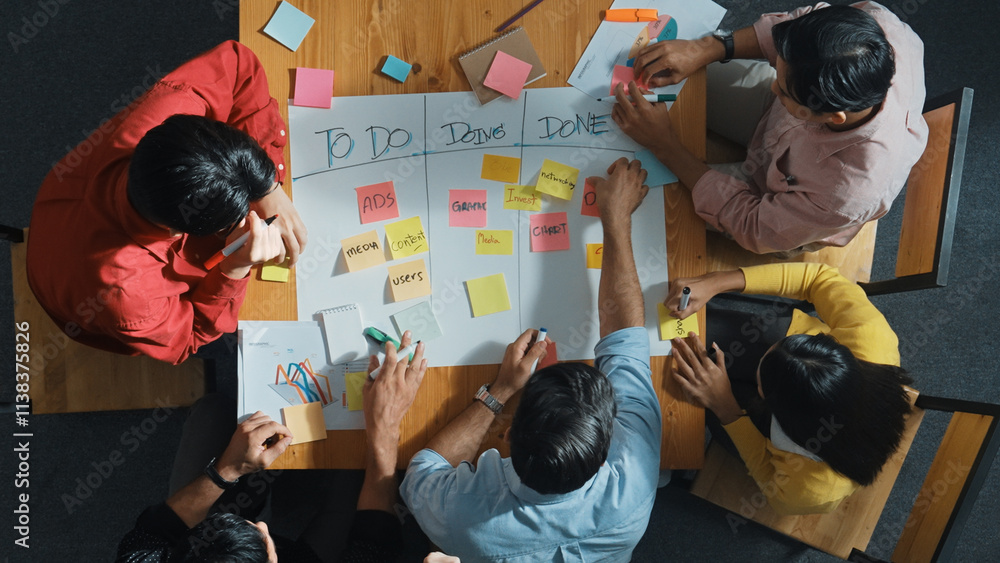 Poster top view of people writing and making scrum task board while writing marketing and planning strategy