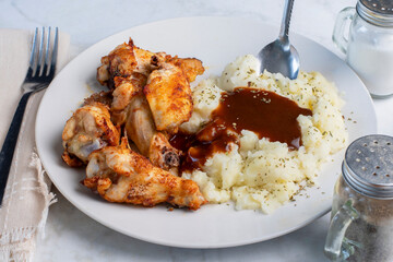 chicken  wings and drumsticks  with mashed potatoes