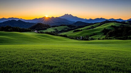 Fototapeta premium Golden Hour Serenity: A breathtaking panorama of rolling hills bathed in the warm glow of a majestic sunset, with mountain peaks silhouetted against the fiery sky.