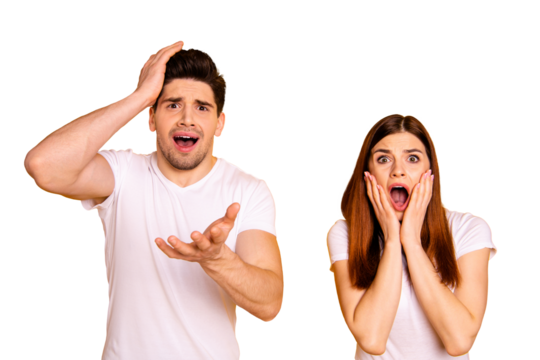 Close up photo amazing she her he him his couple hands arms hold head cheeks stand side by side expression yell unbelievable epic fail wear casual white t-shirts outfit isolated yellow background