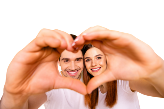 Close up photo amazing pretty she her he him his guy lady hands arms fingers make heart figure faces inside form just married romance mood wear casual white t-shirts outfit isolated yellow background