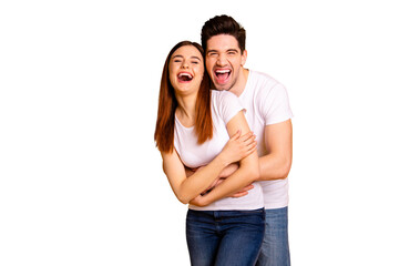 Portrait of his he her she two nice-looking lovely sweet attractive cheerful cheery positive people cuddling laughter isolated over vivid shine bright yellow background