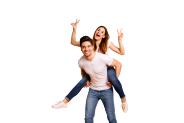 Portrait of his he her she two nice lovely charming attractive playful cheerful positive people showing double v-sign having fun isolated over vivid shine bright yellow background