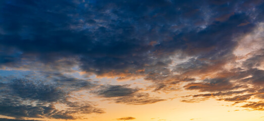 Clouds and sky in the morning,Sunset Sky Clouds in the Evening with colorful Orange, Yellow, Pink and red sunlight and Dramatic storm clouds on Twilight sky, Landscape horizon