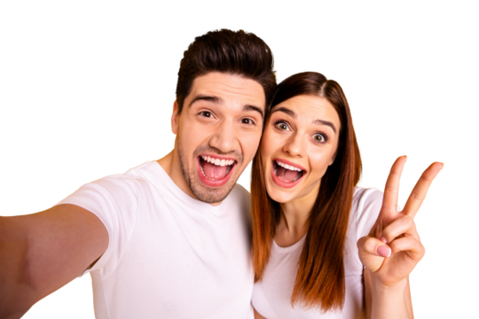 Self-portrait of his he her she two nice attractive lovely trendy cheerful cheery optimistic people husband wife showing v-sign isolated over vivid shine bright yellow background
