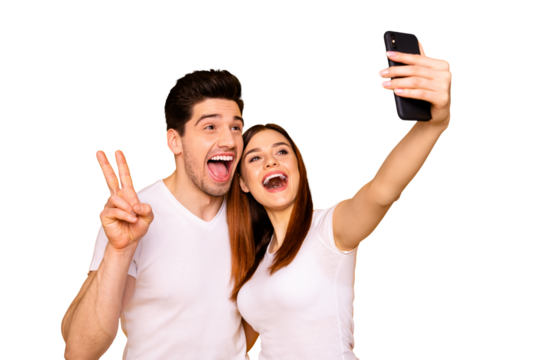 Portrait of his he her she two nice attractive lovely stylish trendy cheerful positive people making taking selfie enjoying showing v-sign isolated over vivid shine bright yellow background