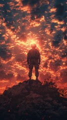 Obraz premium A lone soldier stands atop a rugged rocky terrain as the setting sun casts a dramatic fiery glow across a sky filled with scattered clouds