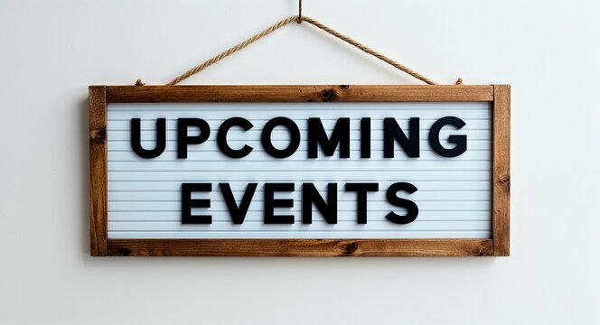 upcoming events lettering on hanging sign board on plain white background