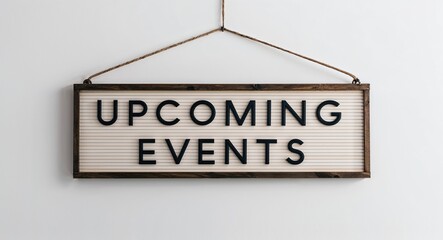Obraz premium upcoming events lettering on hanging sign board on plain white background