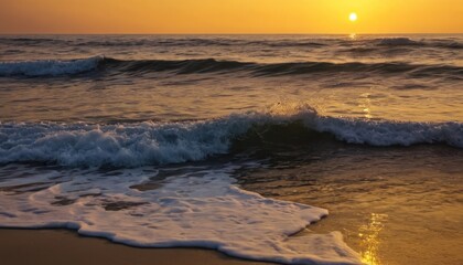 Obraz premium Golden hour paints the sky with hues of orange and pink as the sun dips below the horizon, casting a shimmering reflection on the tranquil ocean
