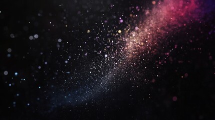 Obraz premium Dynamic Rainbow Dust Explosion on Black Background for Creative Overlays