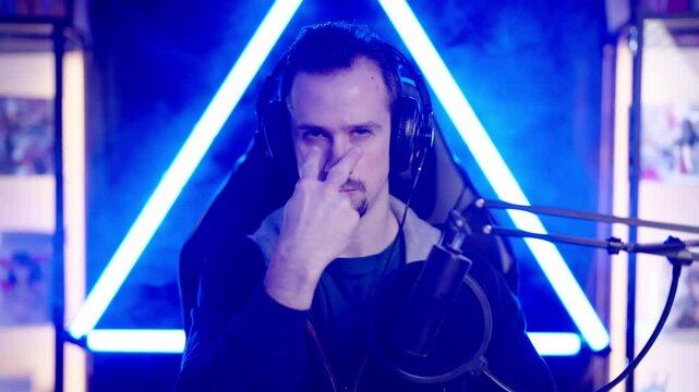 Male gaming streamer angry looking at you pointing with fingers 4K