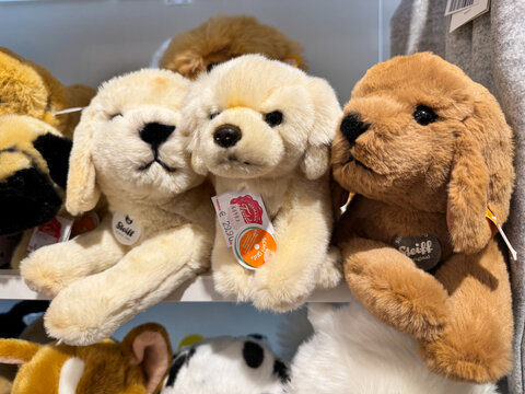 Salzburg, Austria - November 29, 2024: Labrador retreiver plush dogs for sale at Steiff store, selling luxury teddy bears and other plush stuffed animal toys