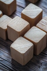 Close-up view of wooden building blocks on a table, suitable for educational or creative purposes