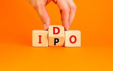 Initial public or DEX offering symbol. Concept words abbreviation IPO or IDO on wooden block....