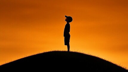 Silhouette of Hope: A solitary figure stands on a hilltop, gazing towards the vibrant sunset. The silhouette evokes a sense of wonder, optimism, and the pursuit of dreams.  
