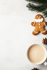Overhead shot, clean white table with mug of hot chocolate and santa gingerbread cookie 