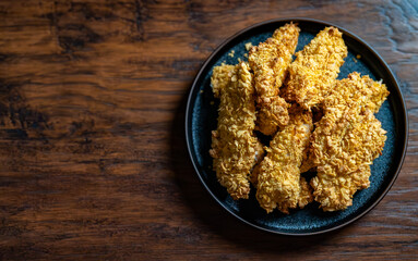 Crispy chicken strips with a golden crust.