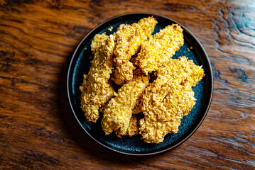 Crispy chicken strips with a golden crust.