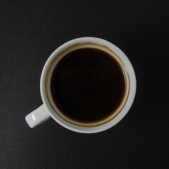 A cup of americano coffee on black background