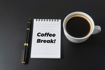 A cup of coffee with a word Coffee Break on black background