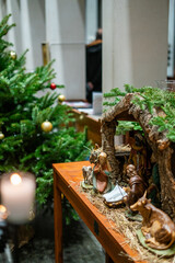 Beautiful Nativity Scene with Figurines Depicting the Birth of Jesus Christ and Village Life at the Guards Chapel church in London, England