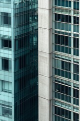 Fototapeta premium Modern architecture contrasting glass and concrete buildings in an urban setting