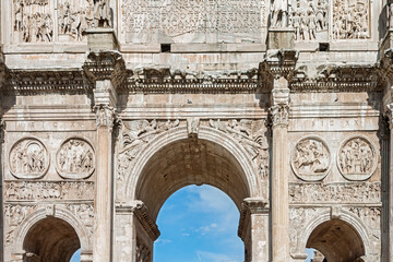 Obraz premium The Arch of Constantine is a triumphal arch, erected by the Roman Senate to commemorate Constantine I's victory over Maxentius at the Battle of Milvian Bridge in 312 AD. Rome, Italy, 2017