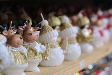 Snowman figures in the form of a candle