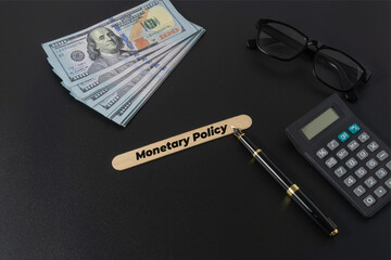 Business concept with a text Monetary Policy on black background