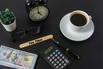 Business concept with a text Tax Time on black background