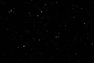 Sparkling snow snowdrifts close-up, perfect as a winter season white background or texture on black background