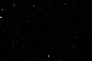 Sparkling snow snowdrifts close-up, perfect as a winter season white background or texture on black background