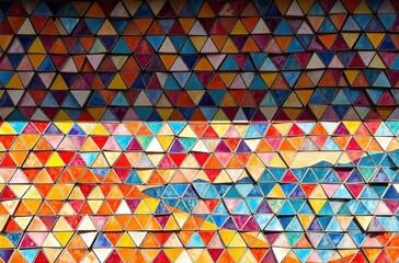 A vibrant mosaic of colorful triangles reveals