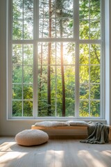 Cozy indoor space with large windows revealing a serene forest view at sunrise