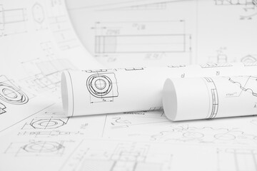 paper engineering drawings of industrial parts and mechanisms