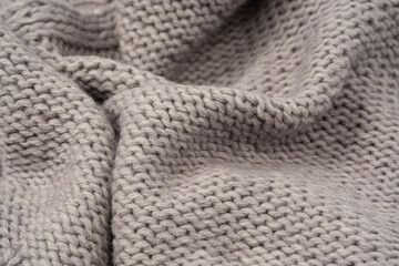 Grey wool sweater texture as a background.