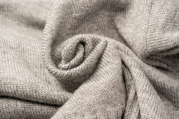 Grey wool sweater texture as a background.