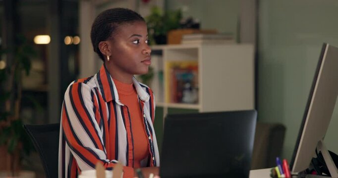 Black woman, laptop and digital work at night in office with ux check and update on company website. Research, admin and professional with deadline and web designer with technology and page review