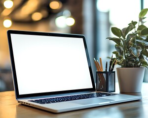 Blank Laptop Screen on Office Desk with Pen Holder and Potted Plant Nearby