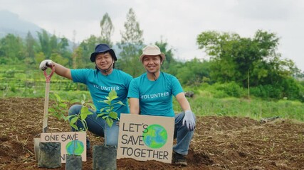 Portrait of Two Activists with Save Earth Posters. Happy Volunteers Ready for Reforestation to Fight Climate Crisis. Tree planting, global warming, nature care, eco initiatives, save the planet