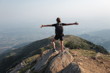 HIKING WOMAN ON THE TOP OF THE MOUNTAIN INDIA DHARAMSALA